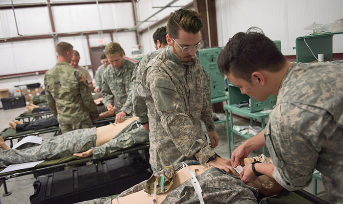 Medical students learning military field medicine