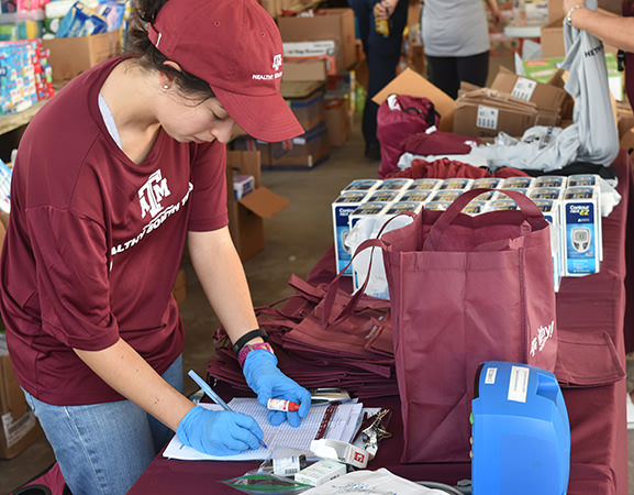 A student collecting supplies at a Healthy South Texas event