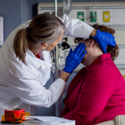 Forensic nurse conducting a patient exam