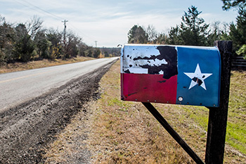 mailbox painted with a Texas flag